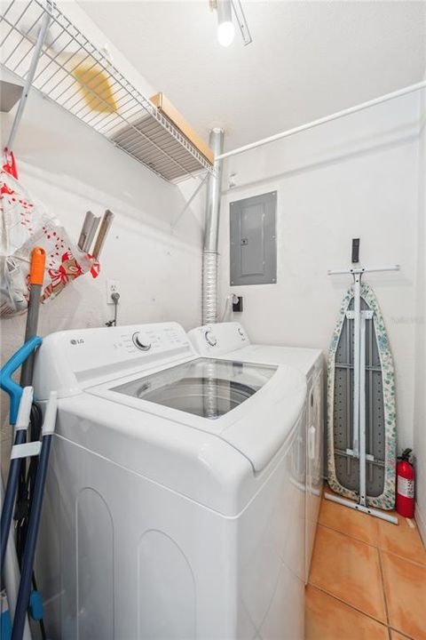 Unit 1107 utility room with its own washer/dryer and exterior back door