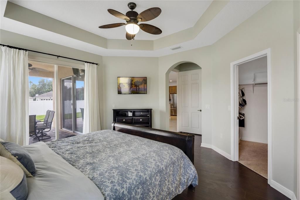 Primary bedroom with slider showing lanai