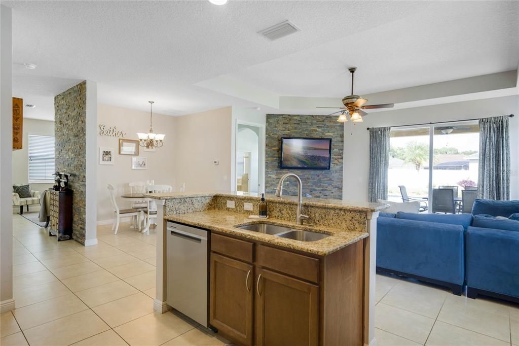 Kitchen showing dinette and family room beyond