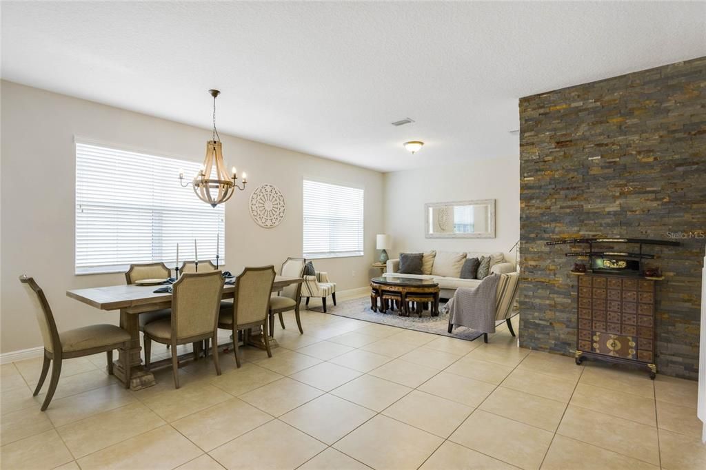 Formal living and dining room with lovely accent wall