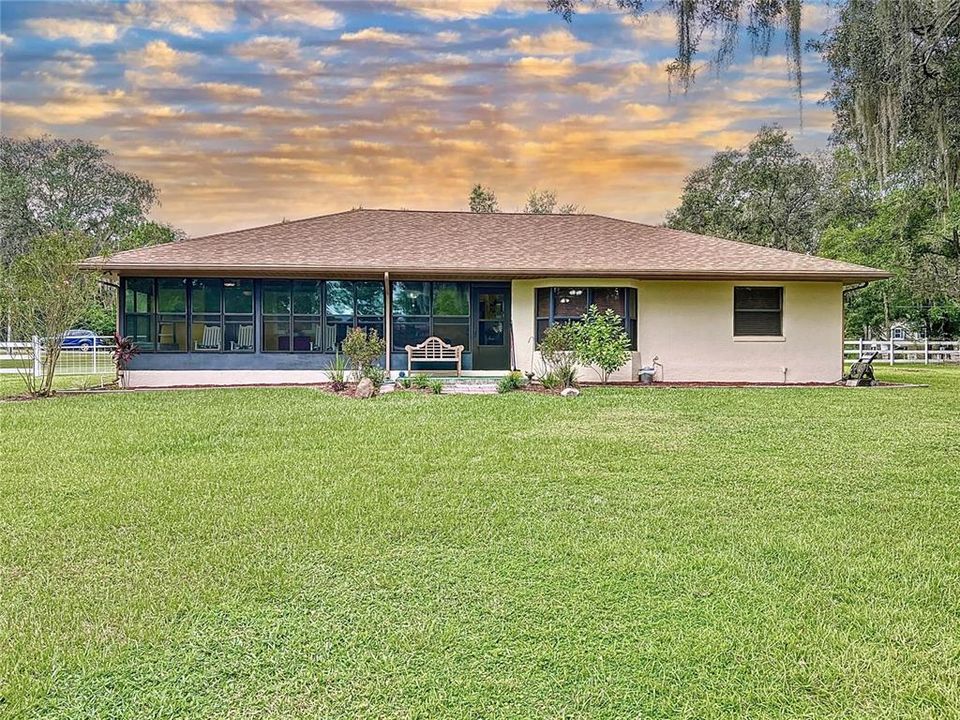 Large back lanai look our to the gorgeous backyard