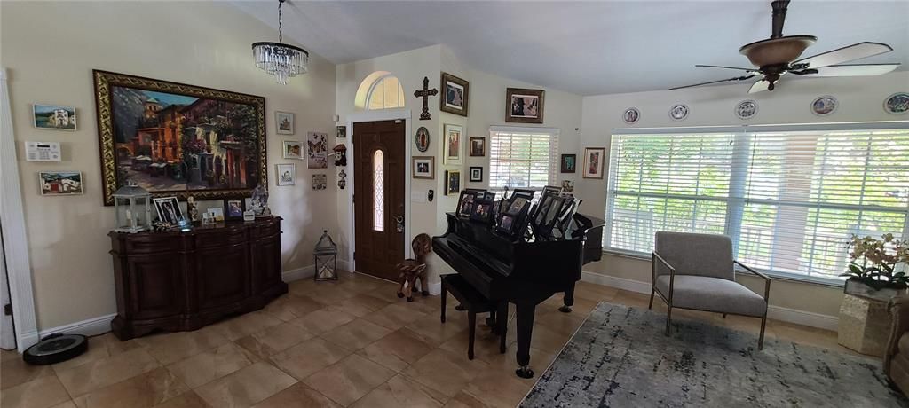 Inside view of the entrance door and living room.