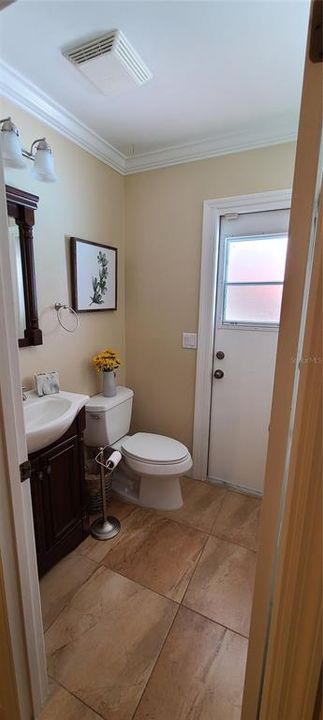 second bedroom bath with pool door.