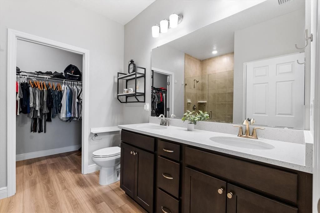 Double vanity in master bath with large walk in closet