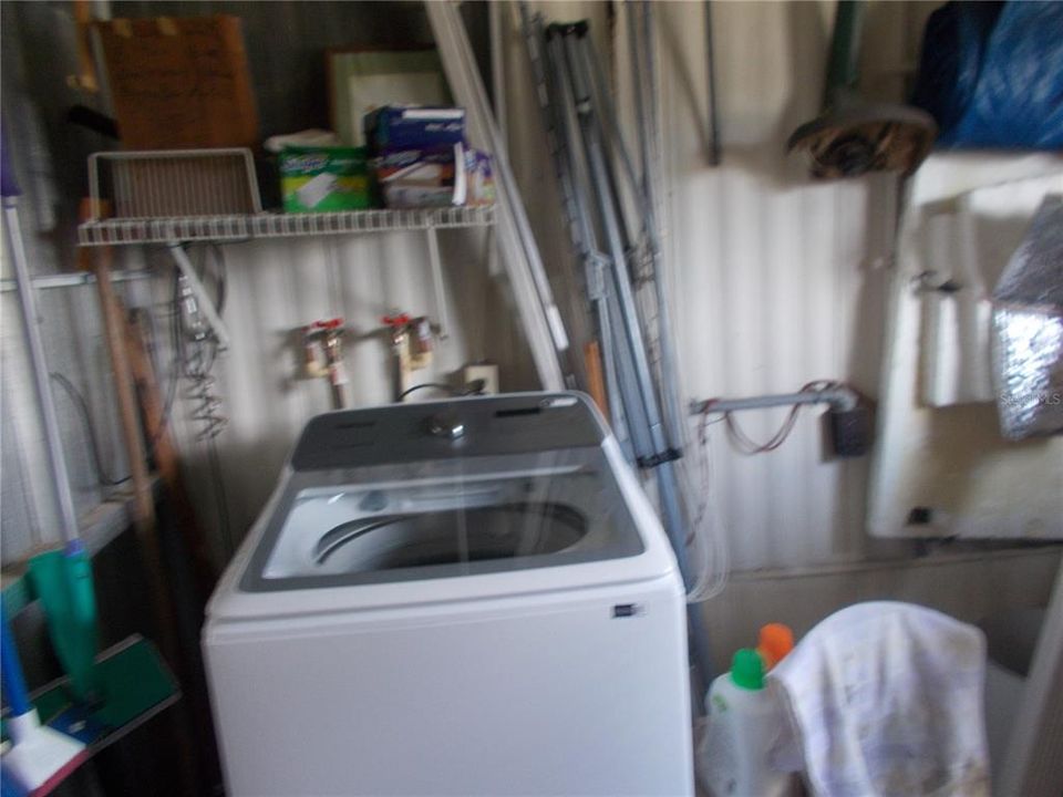 Washer in Shed.  There is a hookup for a dryer