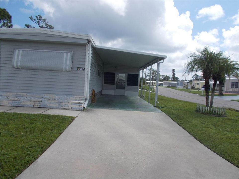 Carport leading to lanai