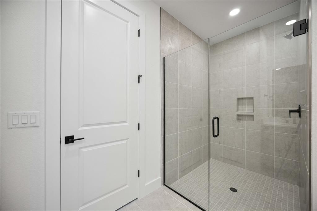 Primary BAthroom large spa shower, tiled walls to ceiling