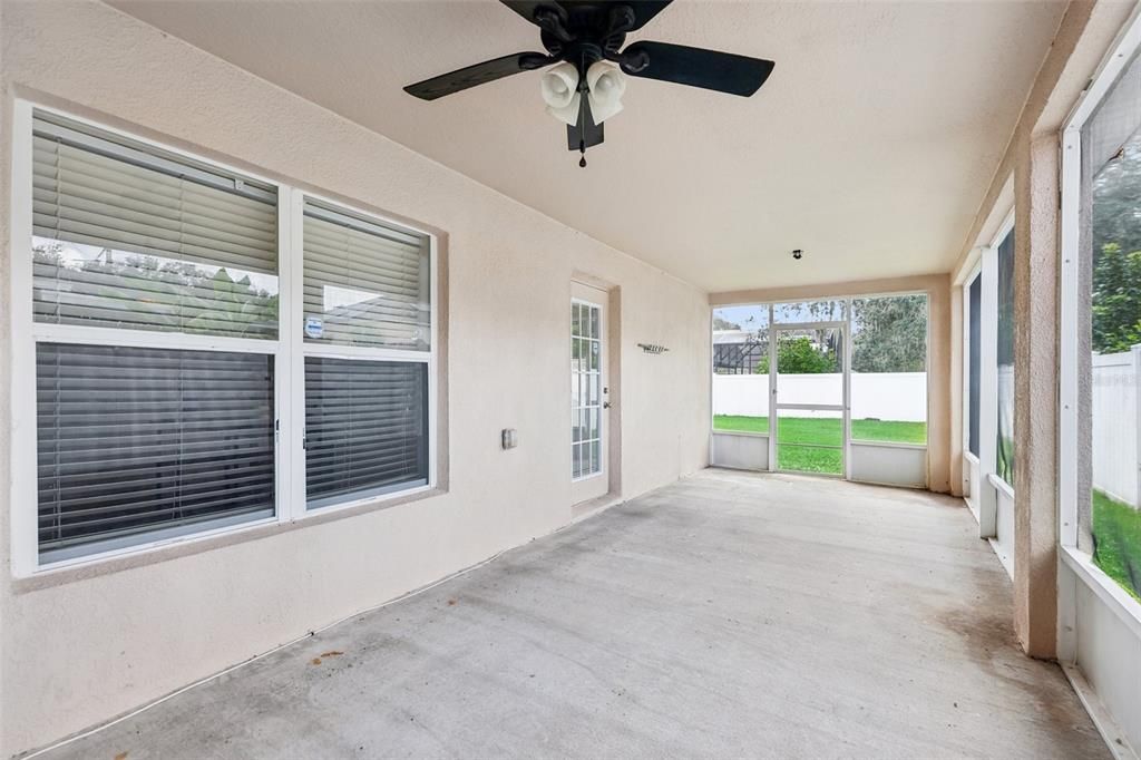 Covered & screened side porch in the backyard