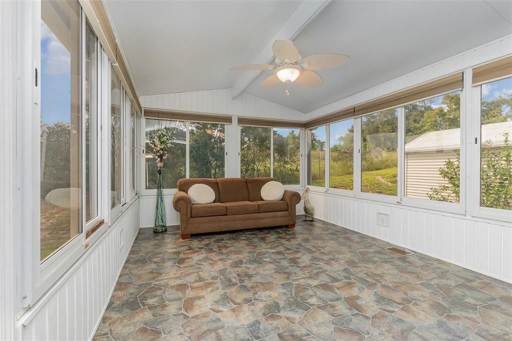 Total privacy since this sunroom backs up to wooded area.