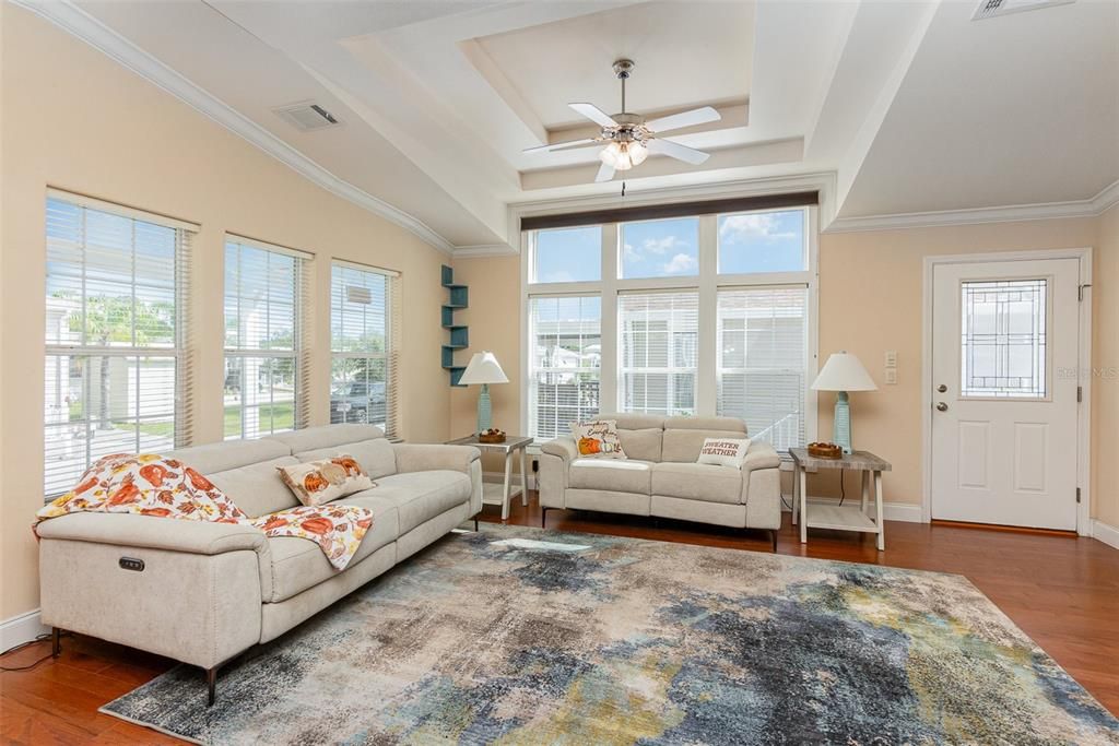 Engineered hardwood floors with multi tray ceiling to enhance the sense of height.