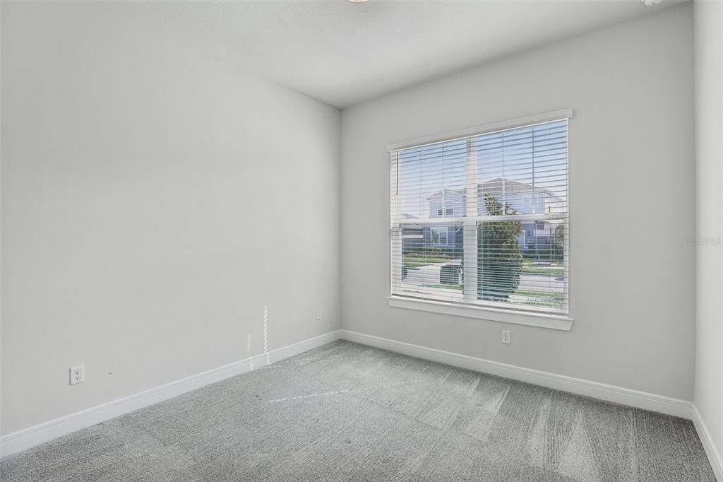 MAIN FLOOR GUEST BEDROOM.