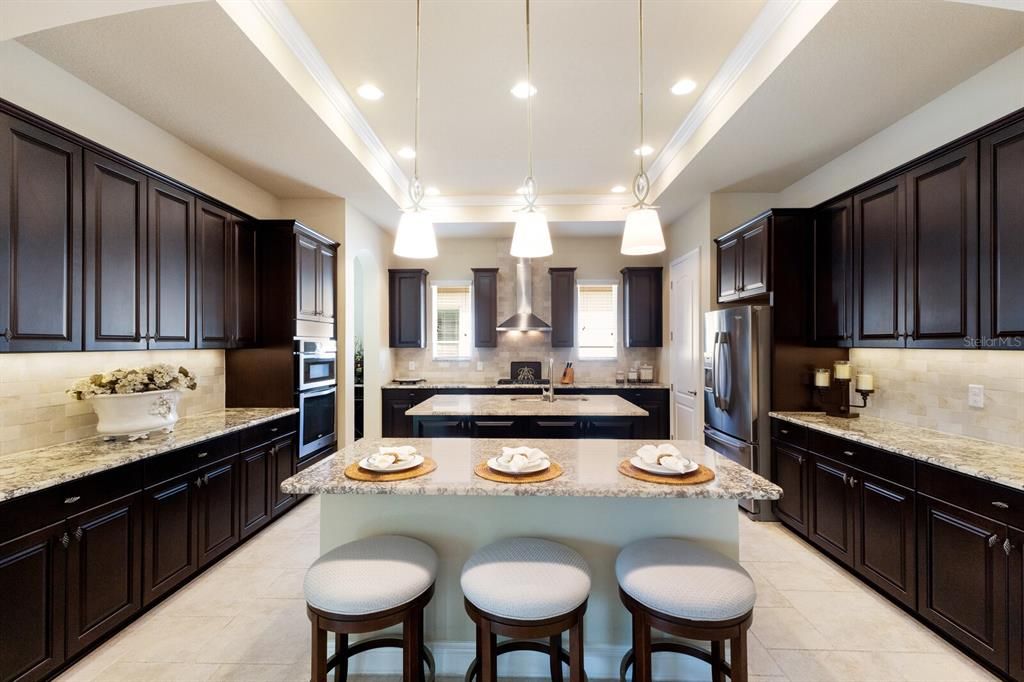 Massive kitchen with breakfast bar and two prep areas