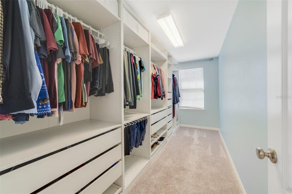 PRIMARY CUSTOM WALK-IN CLOSET.