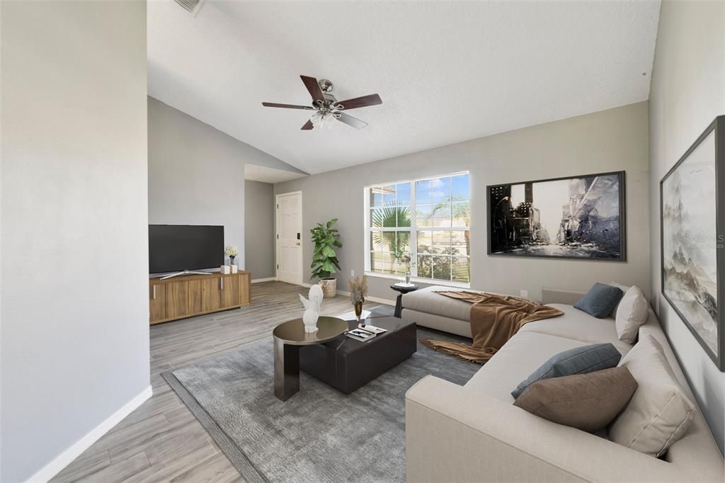 The UPDATED FLOORING throughout the main living areas makes maintenance a breeze and the VAULTED CEILINGS and many windows add to the light and bright feel. Virtually Staged.