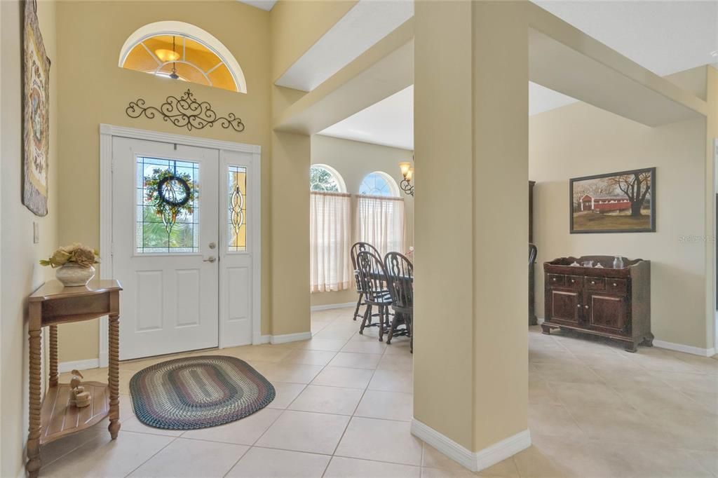 Foyer offering a leaded glass front door and transom window