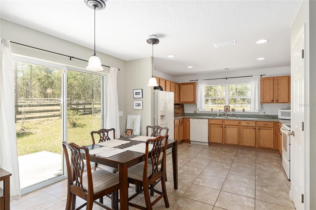 View of dining area, kitchen and outside patio