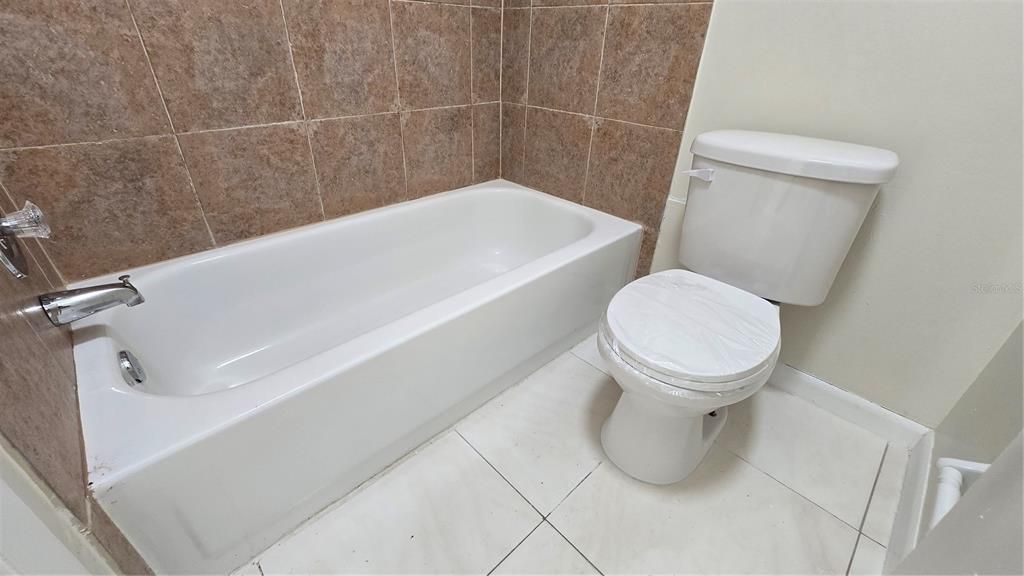 Primary Bathroom - Shower and bathtub