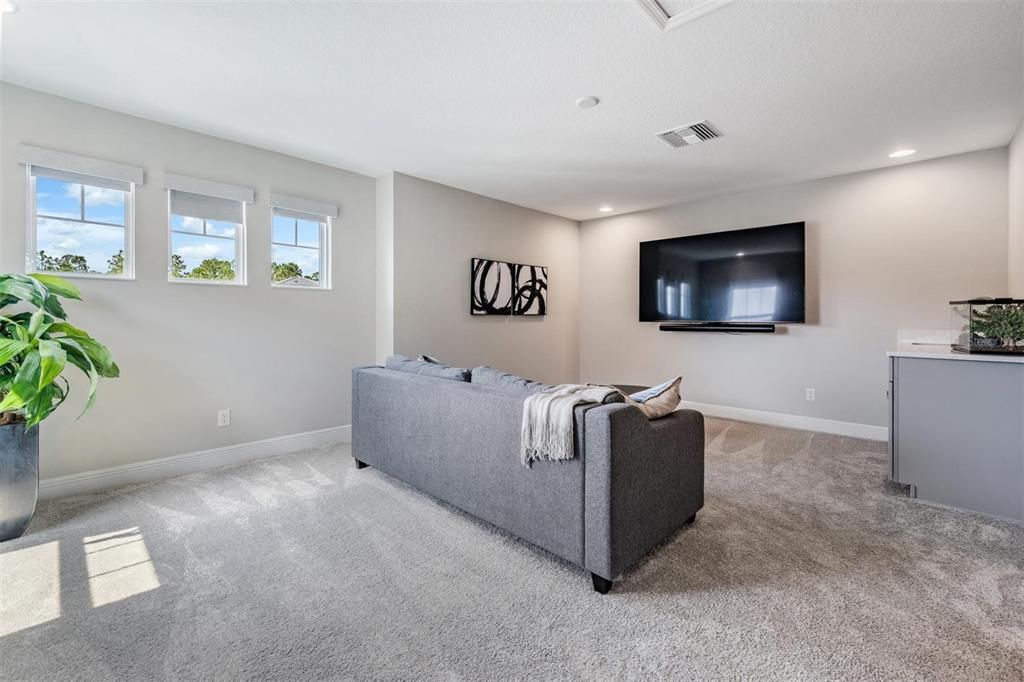 Upstairs bonus room. Almost 250 sq ft of extra living space with a wet bar