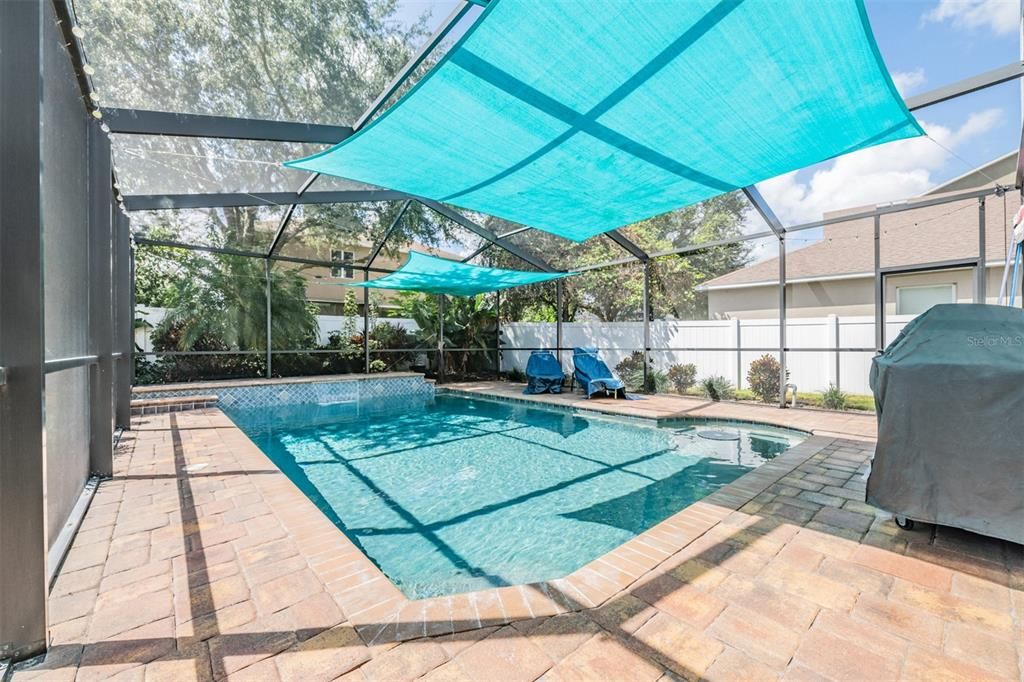 Salt water pool with shade sails for added comfort