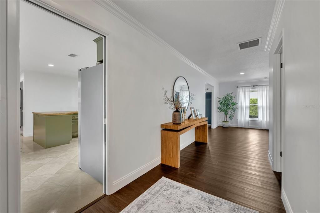 Entry way hall leading to kitchen and bedrooms