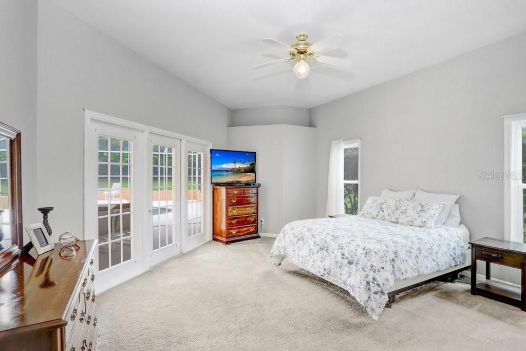 Primary Bedroom with French doors to pool