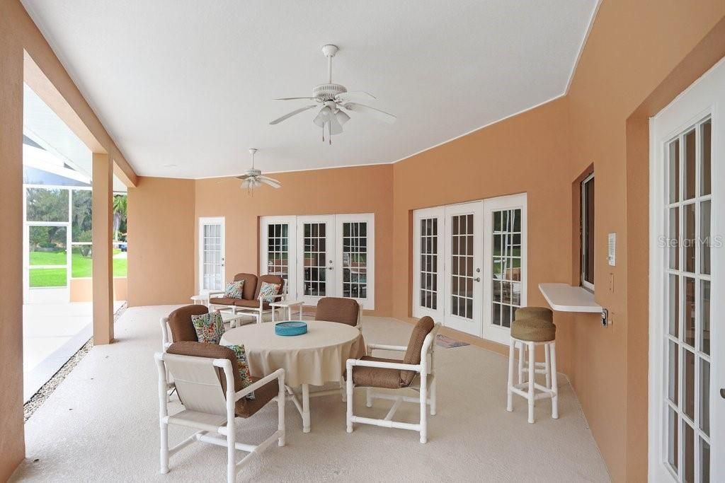 Oversized lanai and pool with spa.  2 ceiling fans, half bath and storage closet