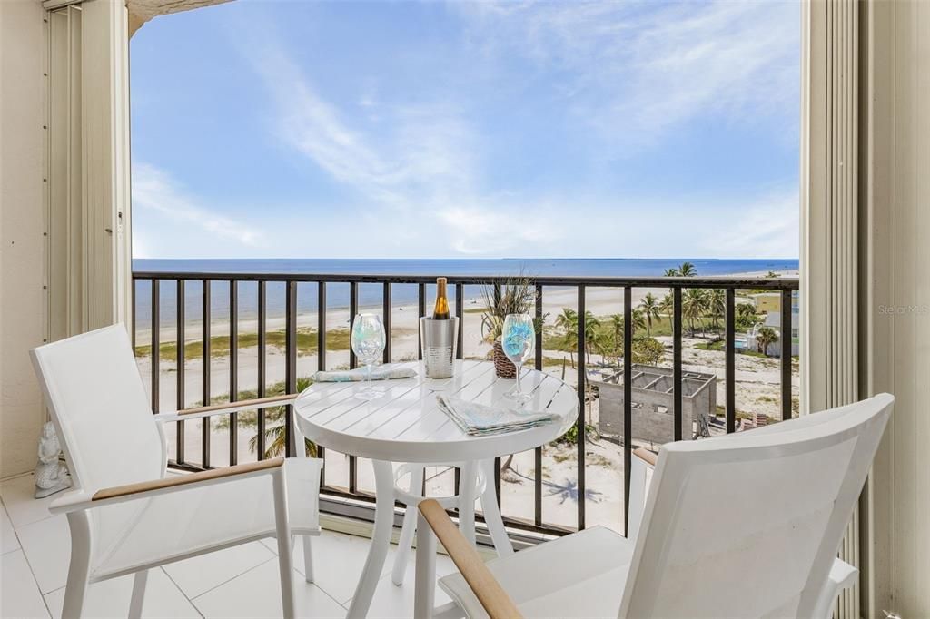 Balcony with a water and beach view