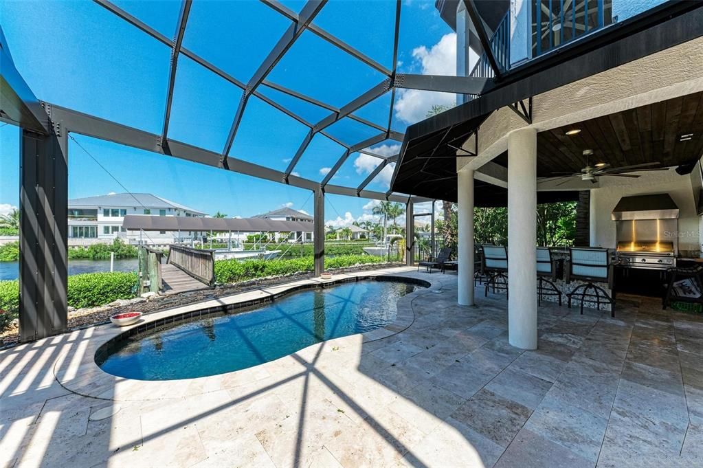 Pool with view to the deck and 2 steps away from your lounge chairs