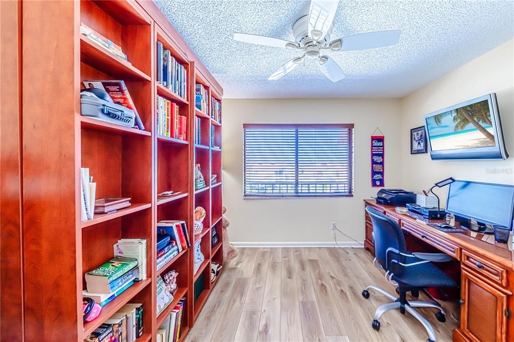 Murphy bed behind bookcase.