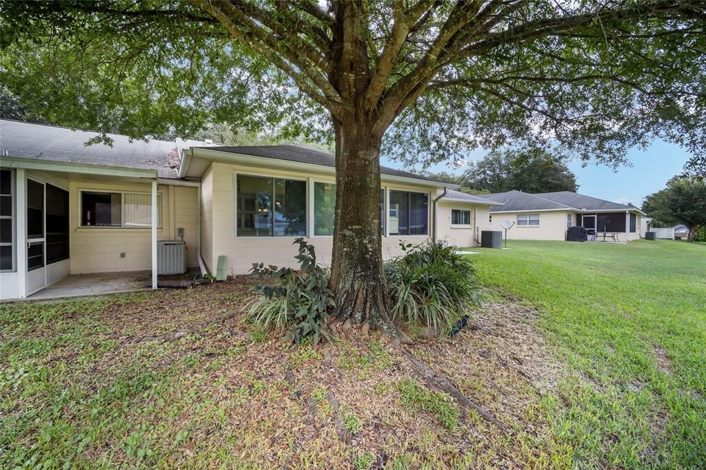 This is a beautiful setting back here.  The AC to the left belongs to the next door neighbors.  Your AC is to the right at the corner of the home.