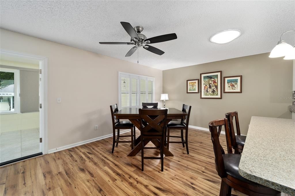 Eat at the breakfast bar/kitchen island.