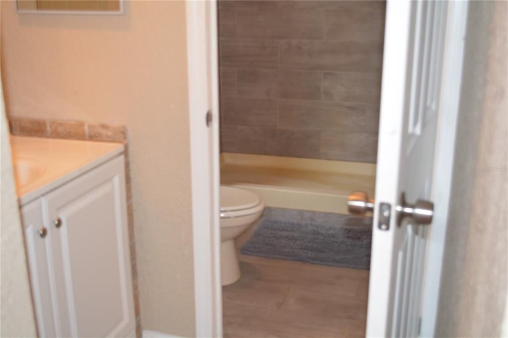 Second bedroom bath with tub and shower