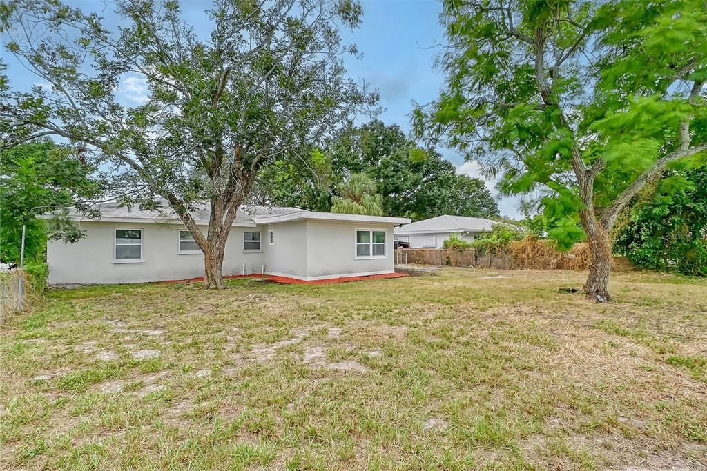 Back Yard has plenty of room for a pool, patio and even a couple of storage sheds!