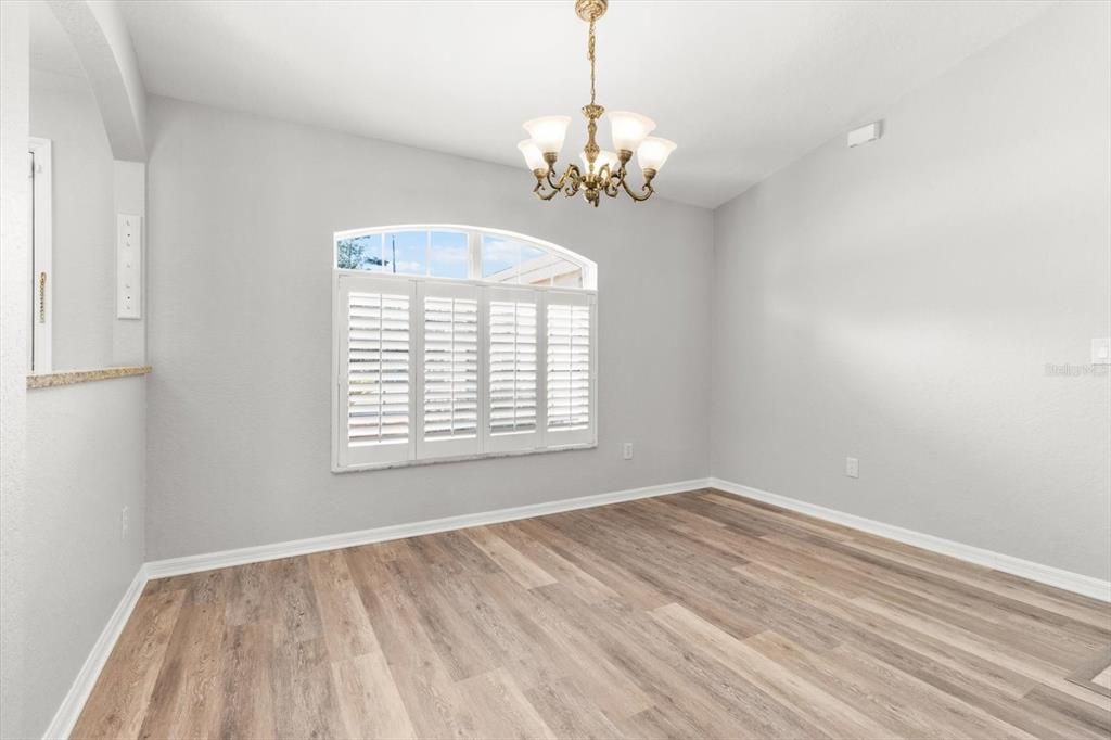 Dining Room w/ Plantation Shutters, Vaulted Ceilings & NEW Luxury Vinyl Planking