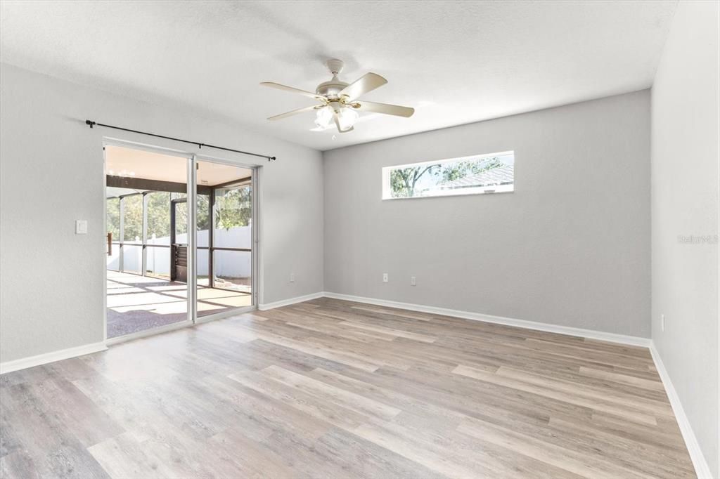 Master Bedroom w/ Ensuite & Slider to the Screened Lanai w/ Pool