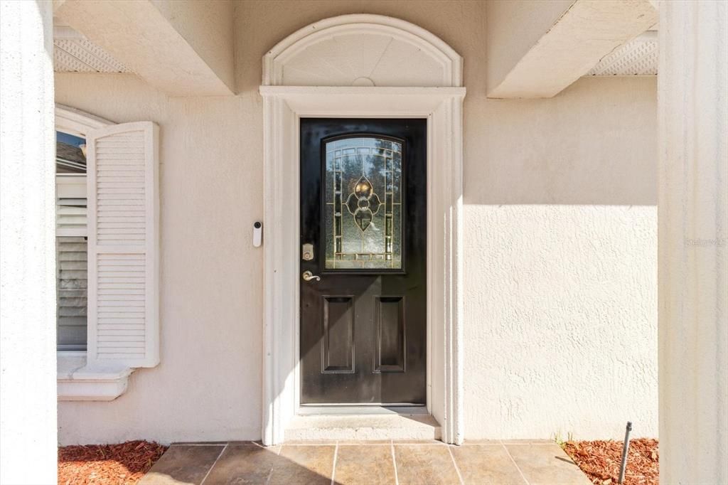 Covered Front Entry w/ Tiled Floor...Ring Doorbell Conveys