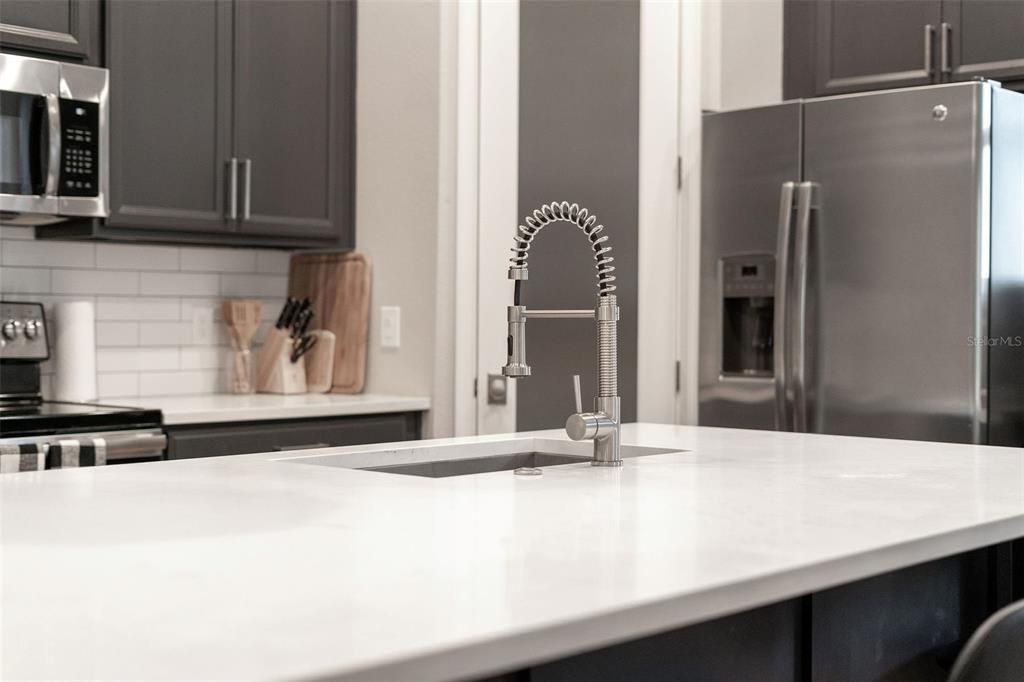 Kitchen with quartz countertops.