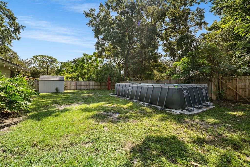 24x12 above ground salt water pool. New shed on that side of yard.