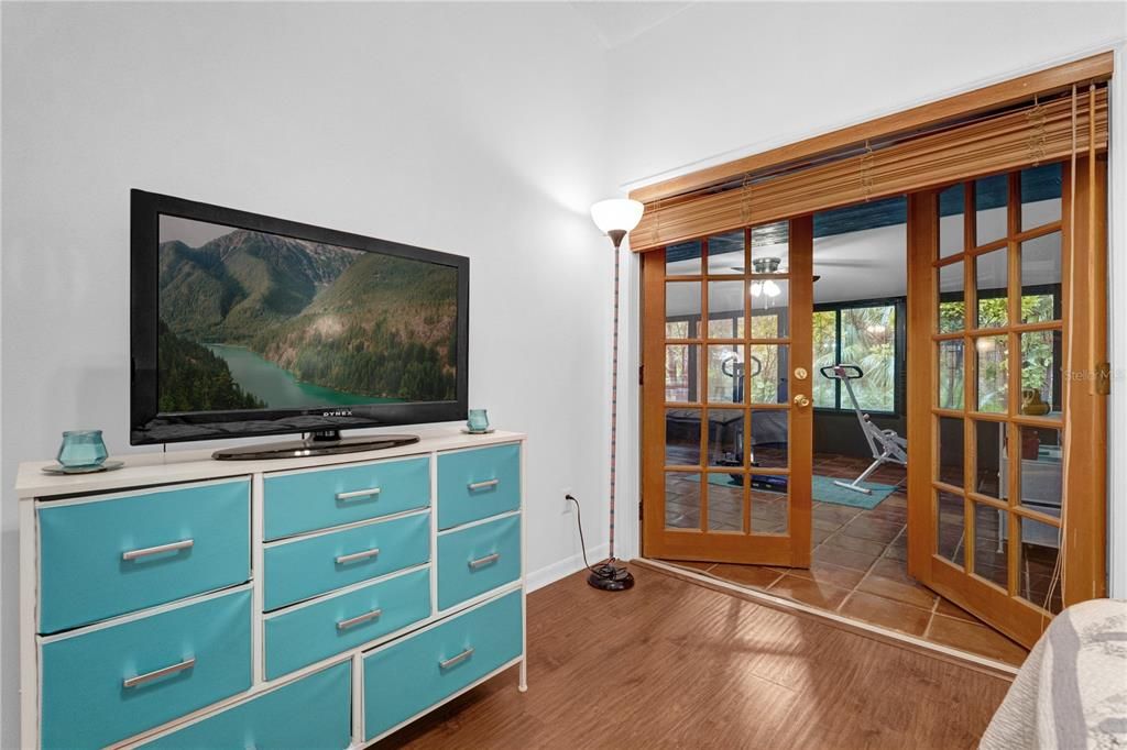 Bedroom entrance to the enclosed porch with windows