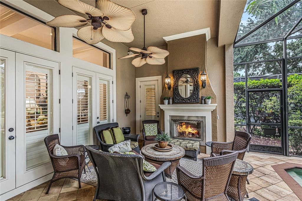 Outdoor gas fireplace and sitting area.