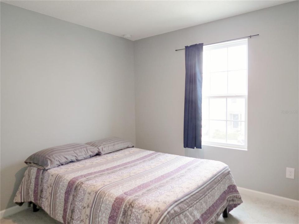 Guest bedroom with neutral paint