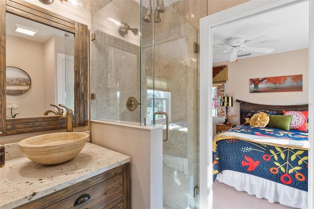 Completely Remodeled "Jack and Jill" Bath to Bedrooms Two and Three with a Single Vanity and Triple Head Walk-in Shower