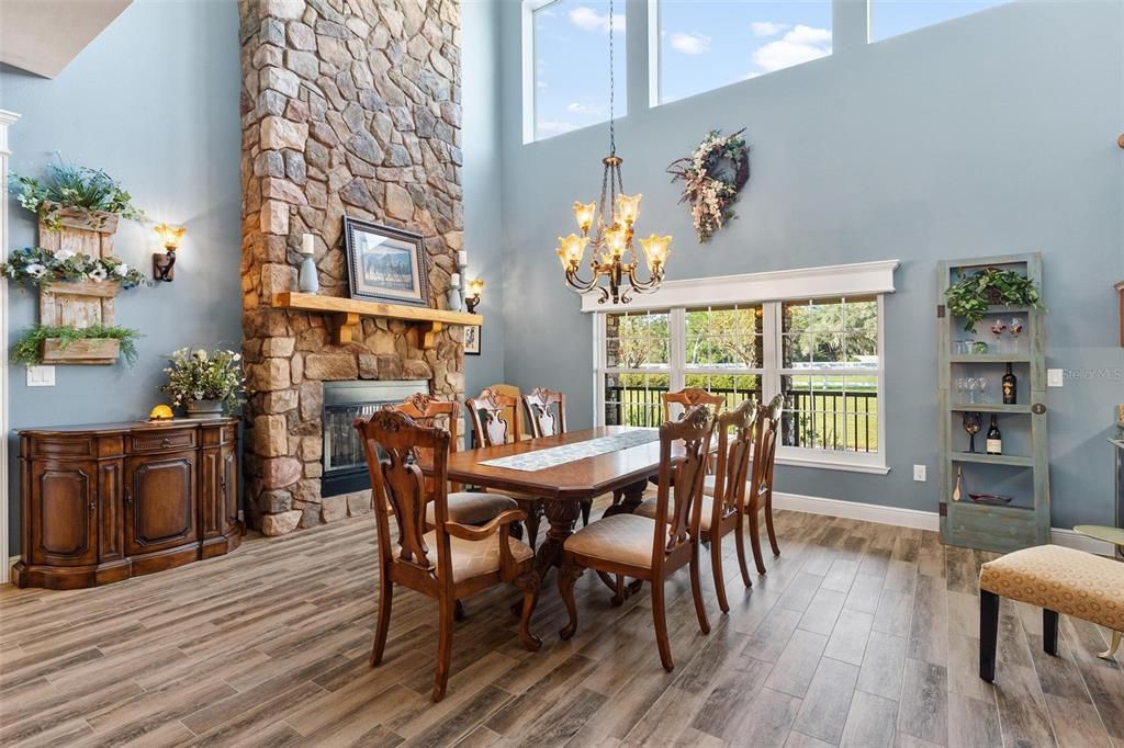 Formal Dining Area with a Stone Fireplace