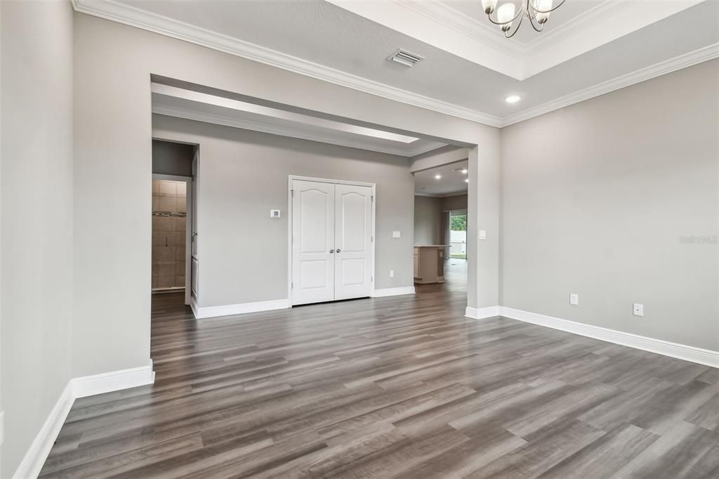 Flex space. Tray ceiling with recessed lighting. Crown molding.