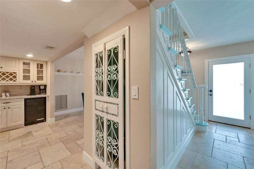 Under-stair storage and butler's pantry between the dining room and kitchen