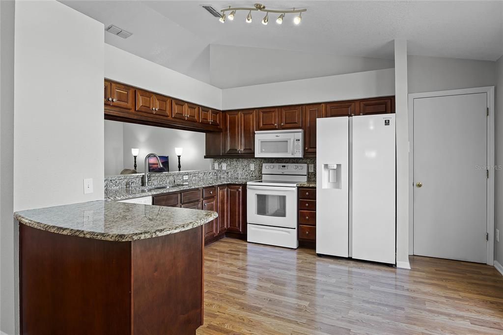 Beautiful Kitchen (with area for barstools on left) makes cooking and cleaning a pleasure