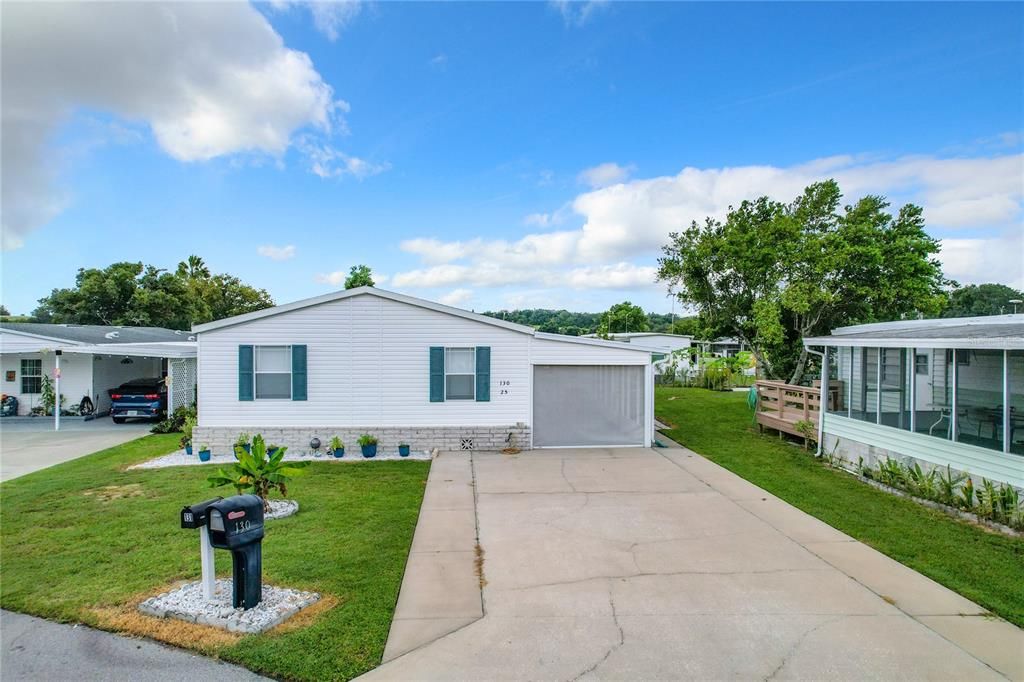 large driveway and screened carport