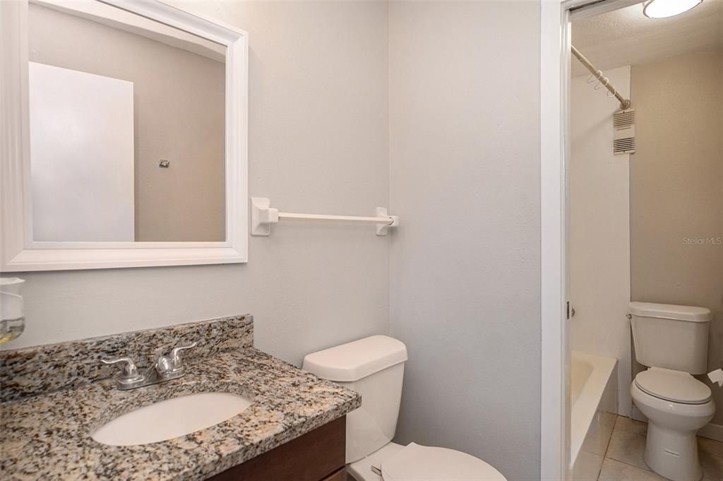 1 full bath and 1/2 bathroom connected with doors for privacy.