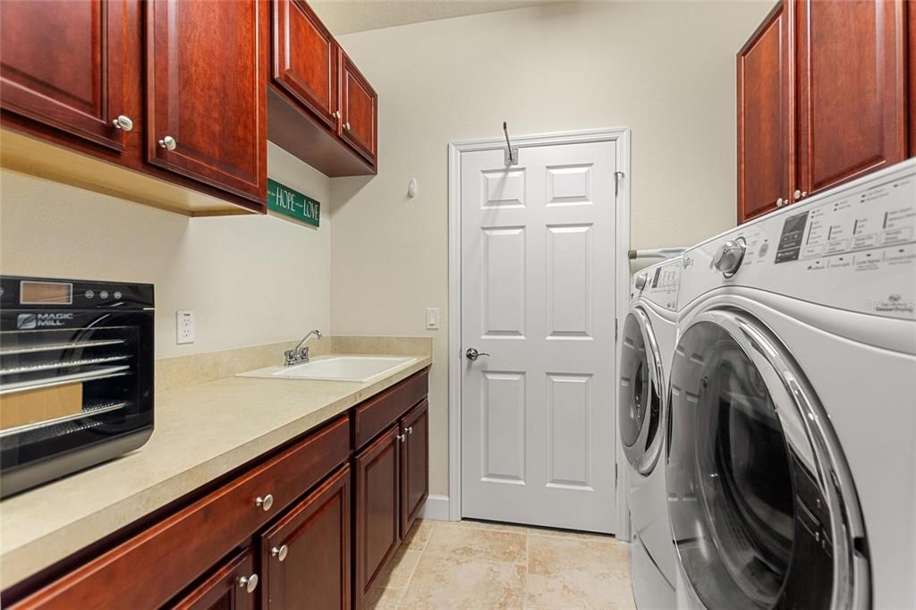 Utility sink and pedestal washer/dryer