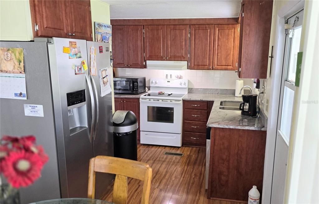 Enter your upgraded kitchen from the doorway protected from the rain.